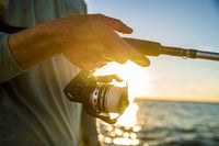 Close-up of PENN Pursuit IV spinning reel and rod handle, focusing on detail and craftsmanship